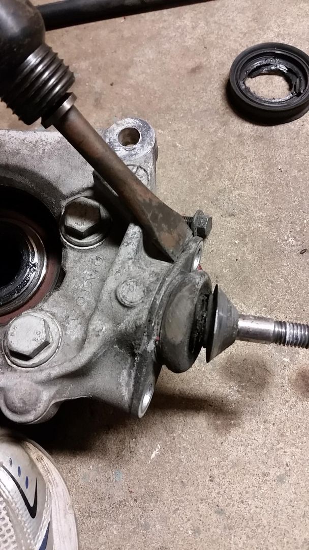 Then line up the new ball joint in the hole using the old bolts and