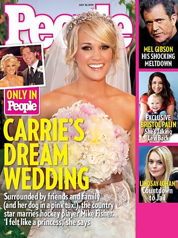 Clutching a huge bouquet Carrie Underwood seems very happy